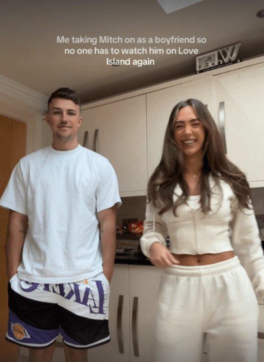 Mitch and his girlfriend in their kitchen.