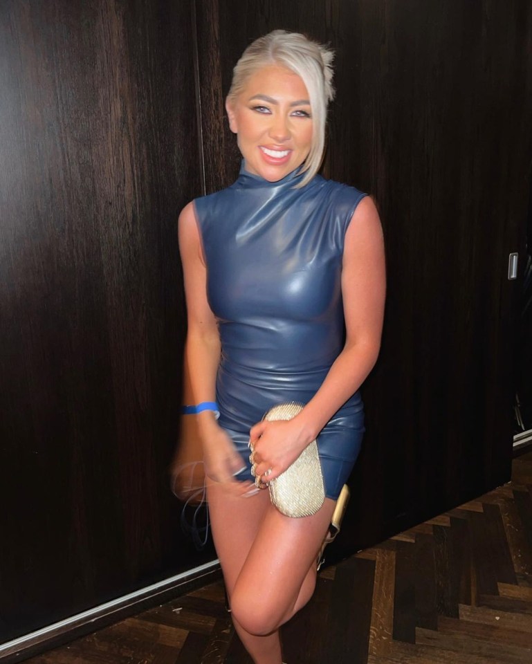 Paige Turley in a blue leather dress.