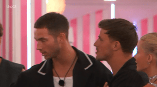 Love Island contestants reacting to a revelation.