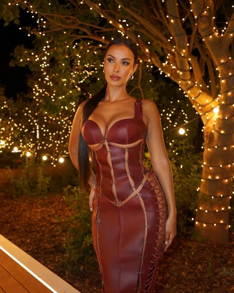 Maya Jama in a burgundy cutout dress.