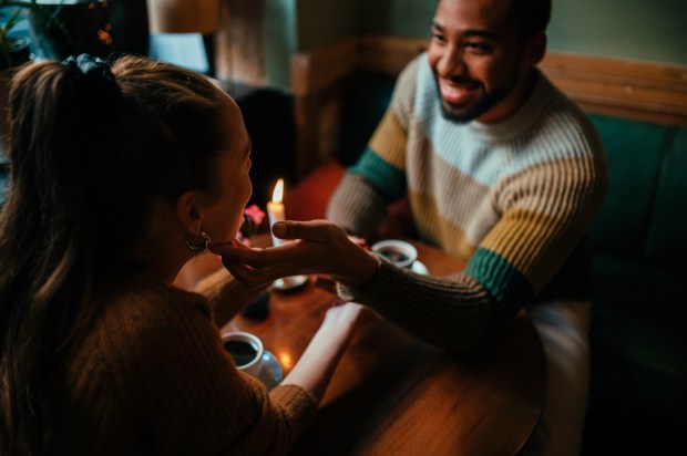 Couple on a romantic date at a cafe.