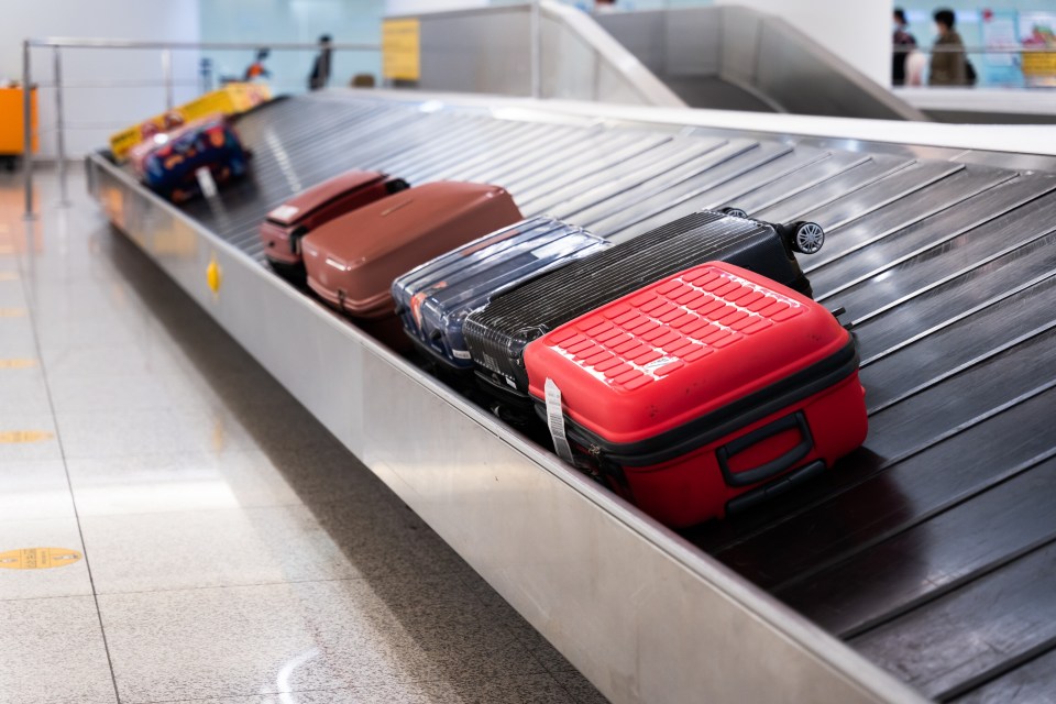 Luggage on an airport baggage carousel.