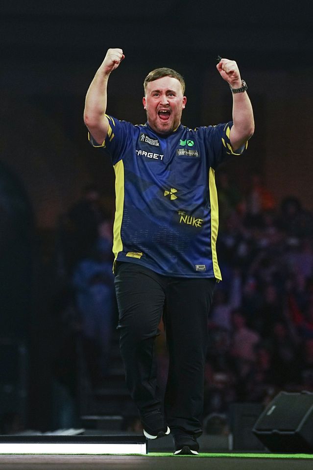 Luke Littler celebrates a winning dart throw at the PDC World Darts Championship.