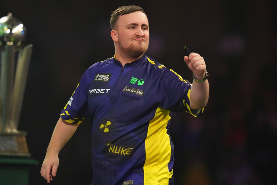 Luke Littler celebrates at the World Darts Championship.