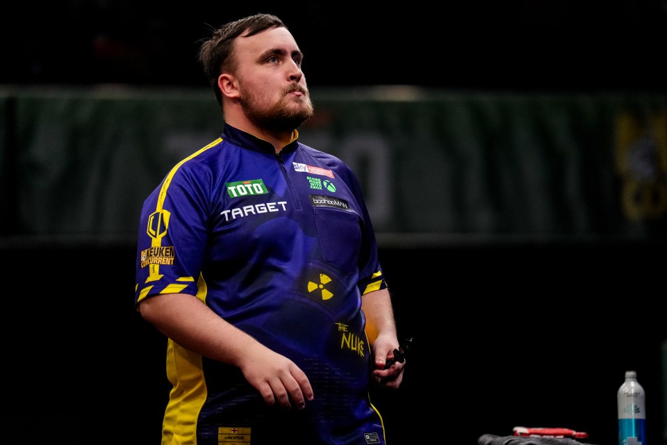 Luke Littler, a darts player, during a match.