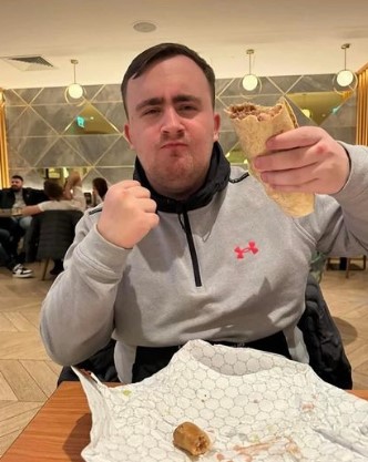 Man holding a kebab.