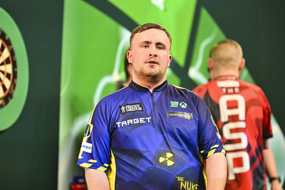 Luke Littler, relieved after winning a darts match.