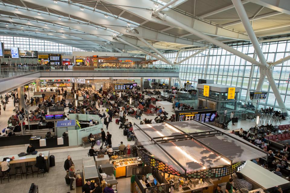 Heathrow Terminal 5 interior with shops and seating areas.