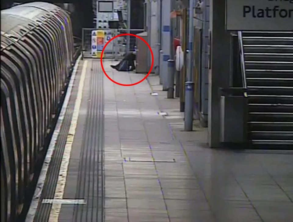 CCTV image of a man on a subway platform.