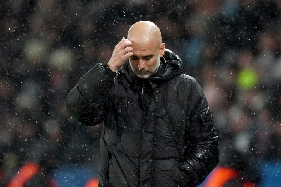 Pep Guardiola reacting during a soccer match.