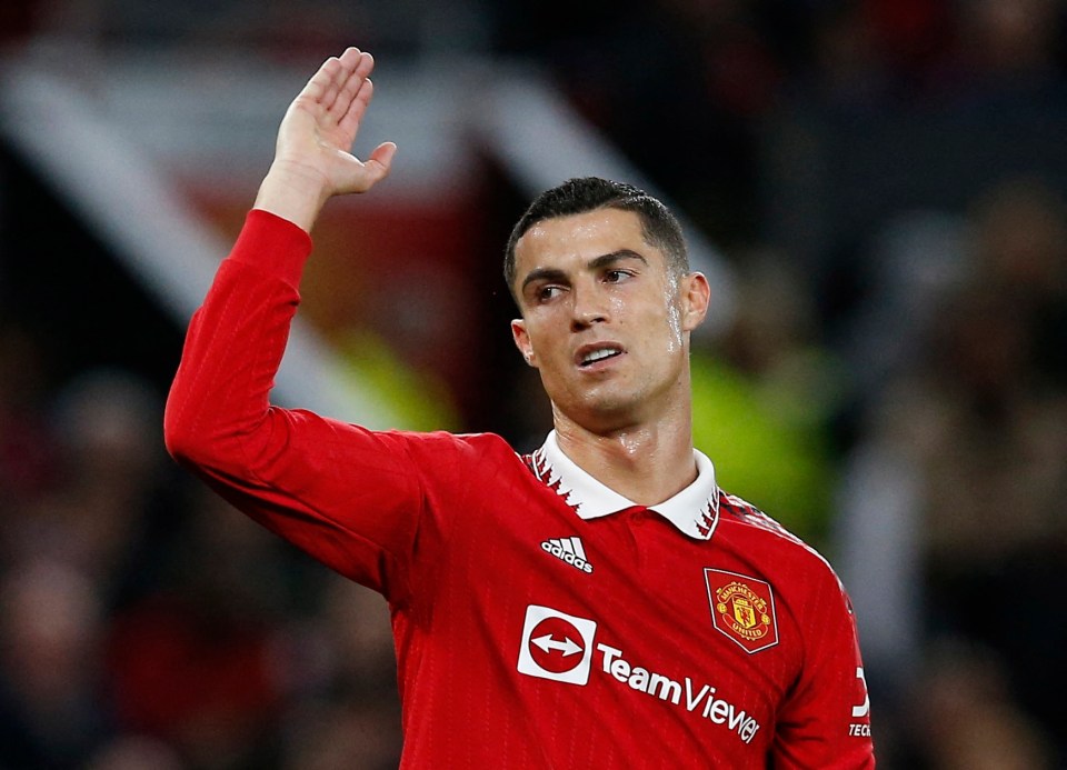 Cristiano Ronaldo in Manchester United jersey waving.