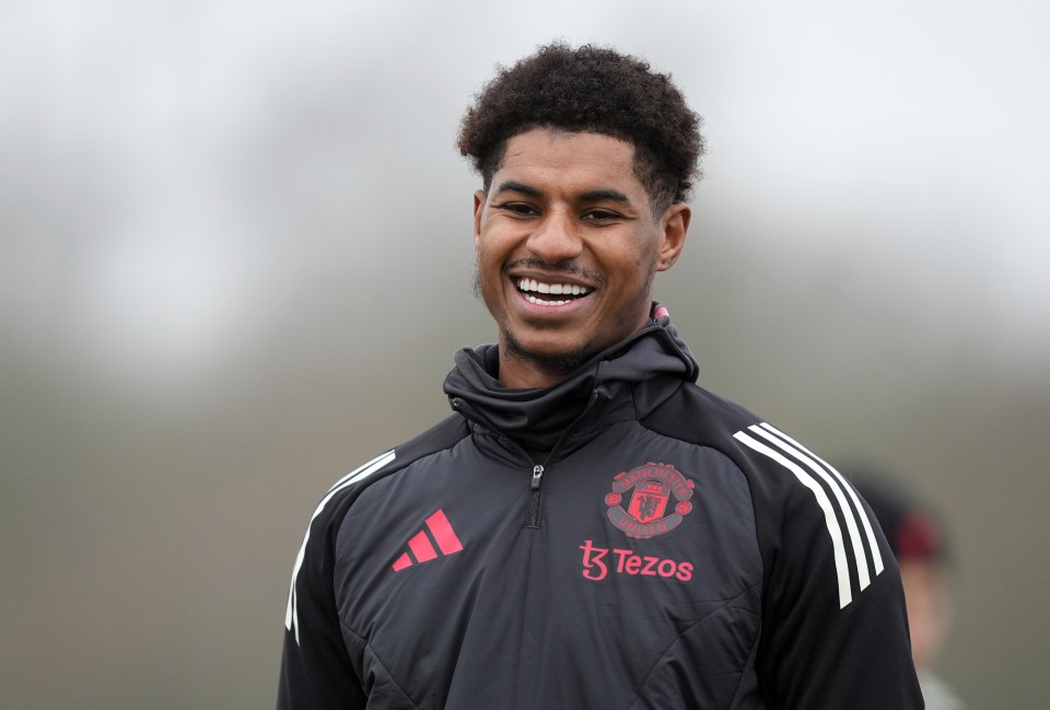 Marcus Rashford smiling during a Manchester United training session.