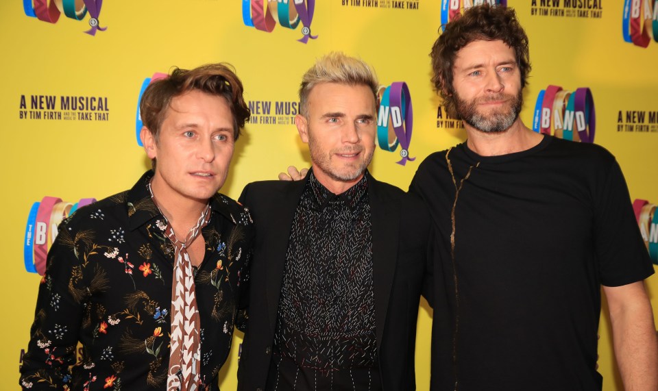 Mark Owen, Gary Barlow, and Howard Donald of Take That.