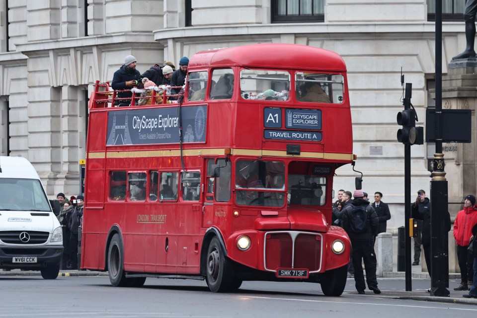 Film crew on a London double-decker bus.