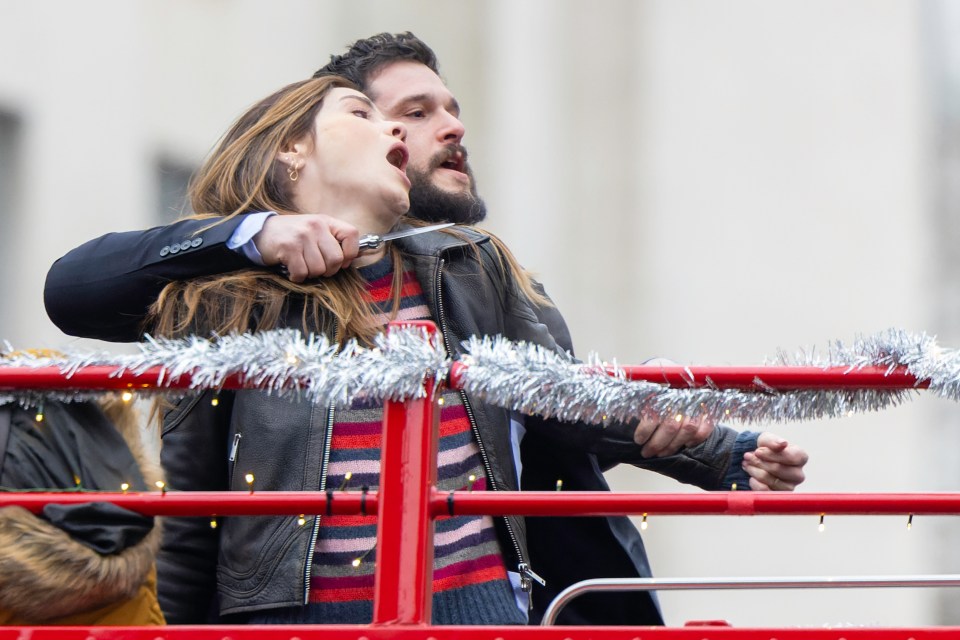 Kit Harington holding Michelle Monaghan at knifepoint during filming of "The Family Plan 2".