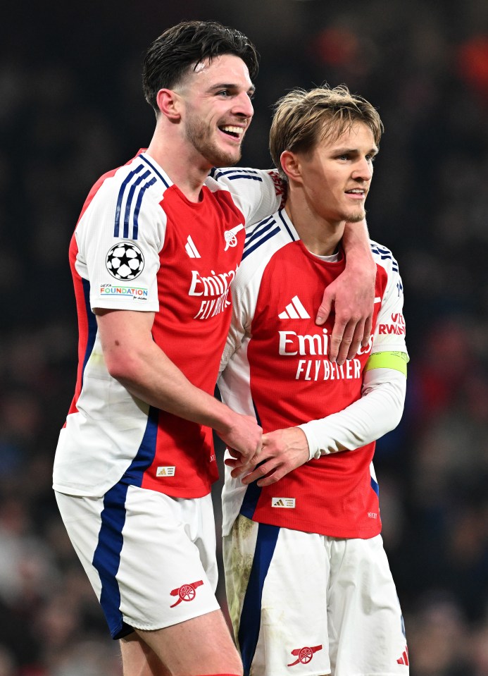 Martin Odegaard and Declan Rice of Arsenal celebrating a goal.