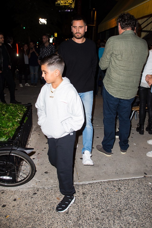 Mason and Scott Disick walking in SoHo.