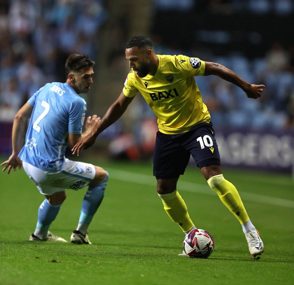 Soccer player controlling the ball during a match.