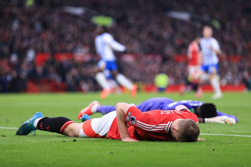 Matthijs de Ligt of Manchester United lying on the field after conceding a goal.