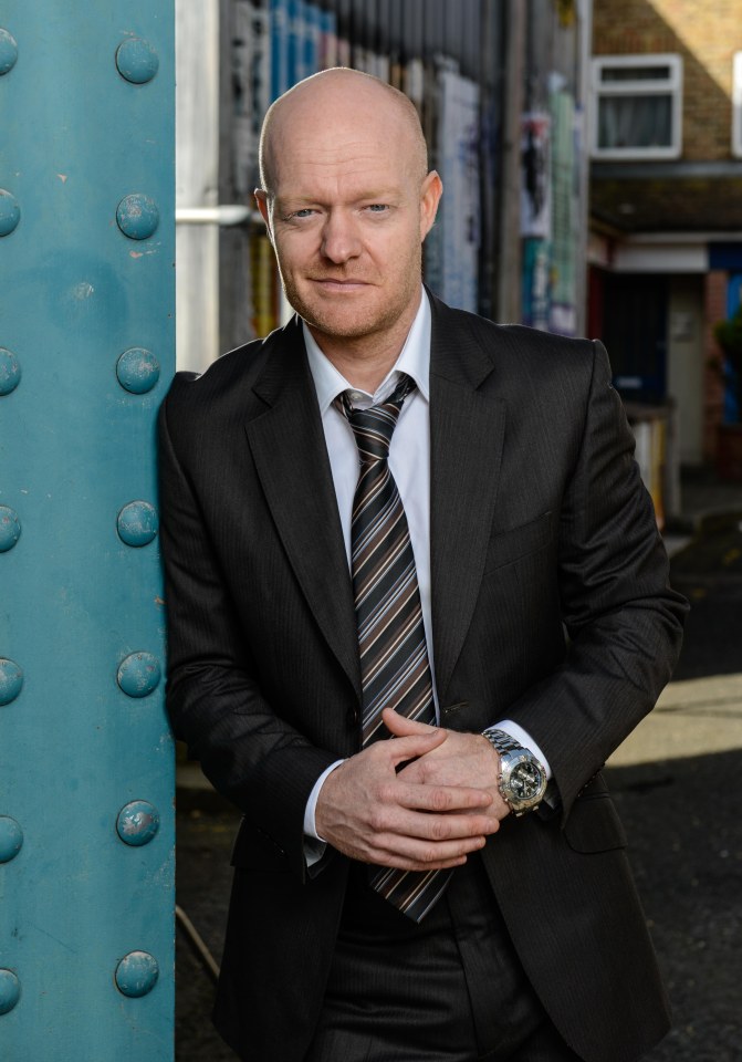 Portrait of Jake Wood in a suit.