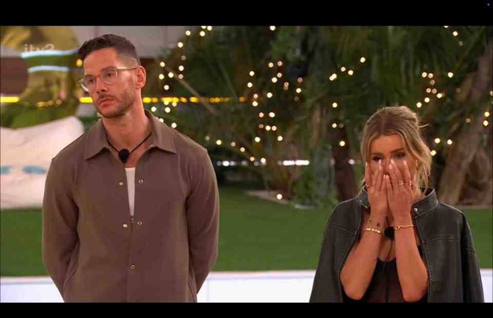 A man and woman react emotionally in a scene from Love Island.