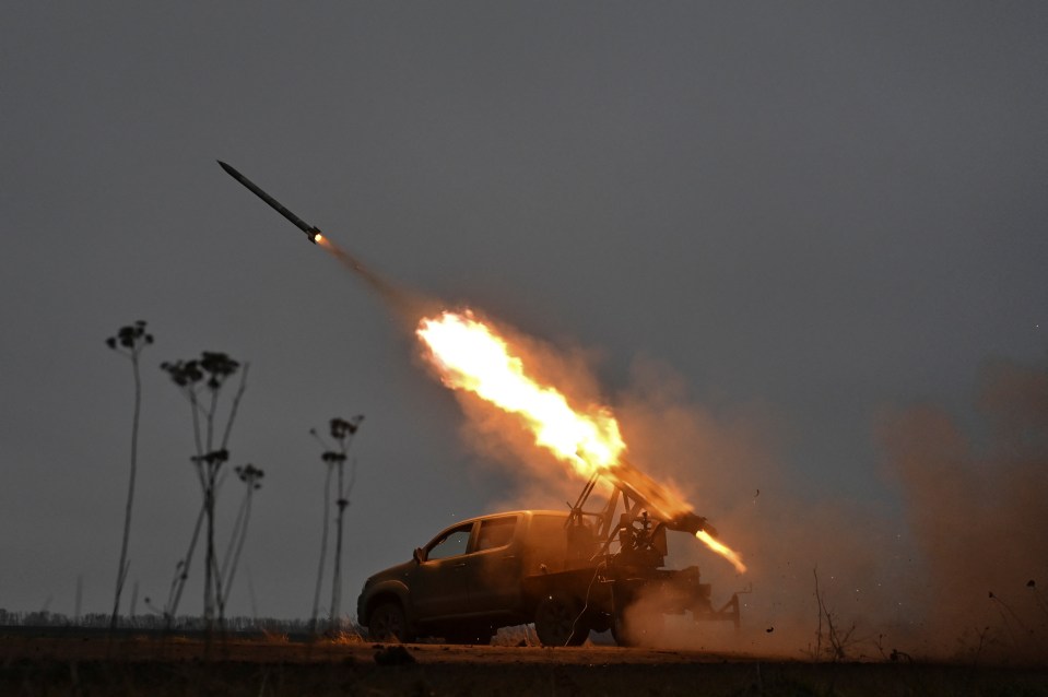 Members of the artillery unit of the special rifle battalion of Zaporizhzhia region police fire towards Russian troops in a frontline