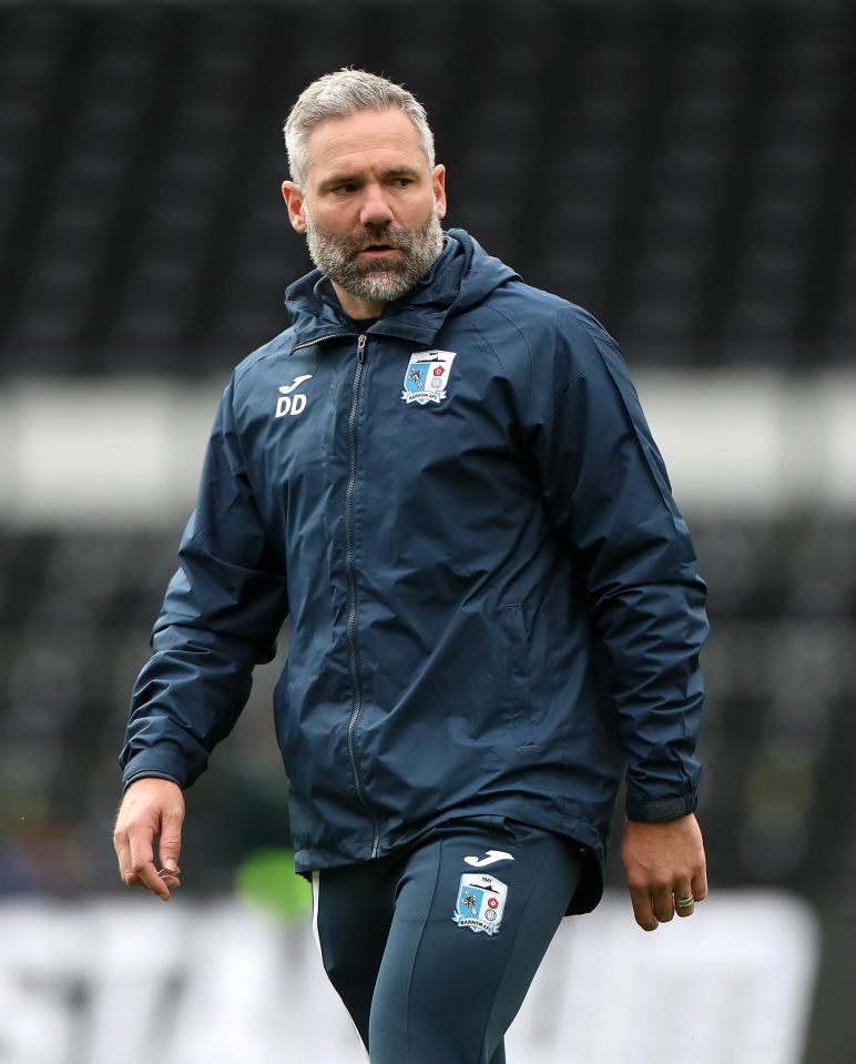 Barrow manager David Dunn at a soccer match.