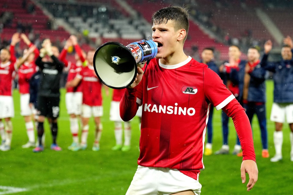 Soccer player Milos Kerkez of AZ Alkmaar using a megaphone.