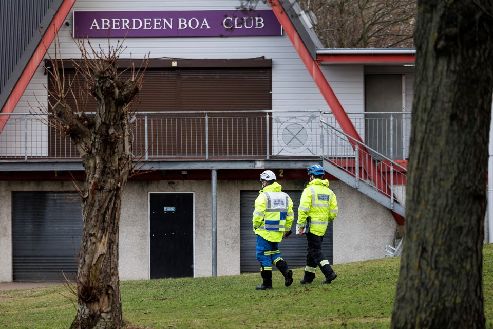 Police and coastguard officers near Aberdeen Boat Club.