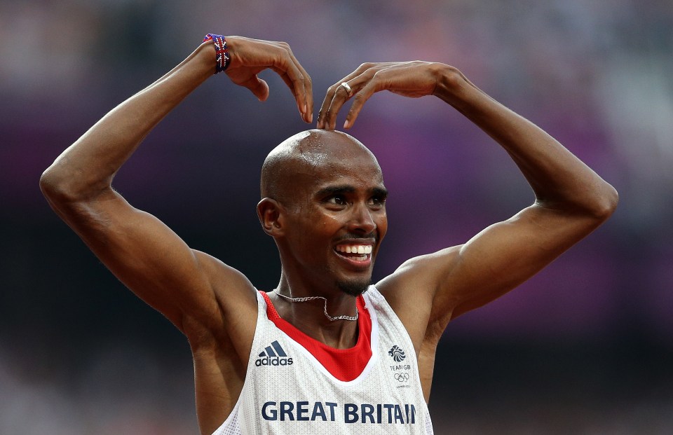 Mo Farah of Great Britain making a heart shape with his hands after winning a gold medal.