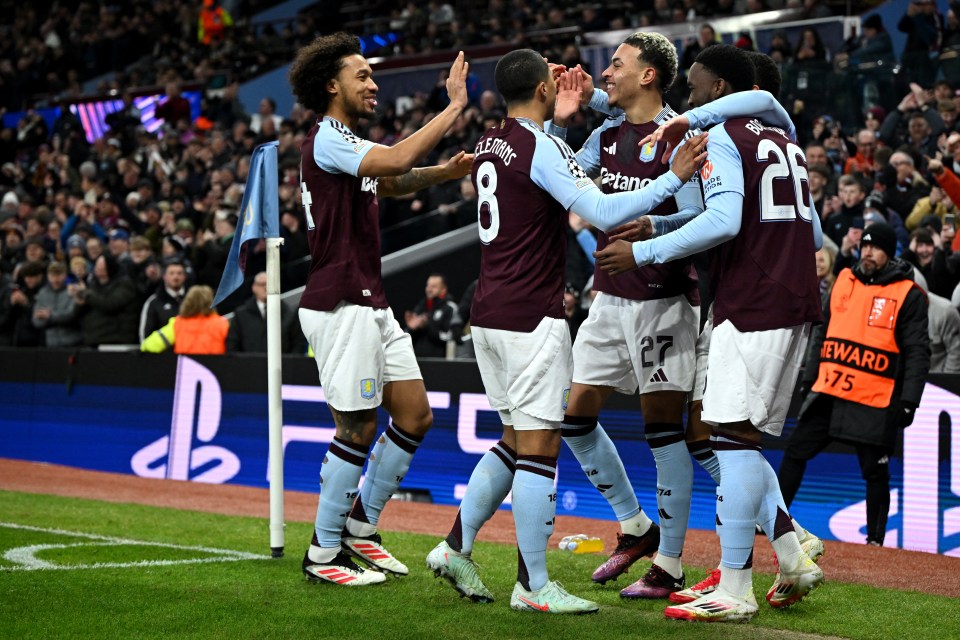 Aston Villa players celebrating a goal.