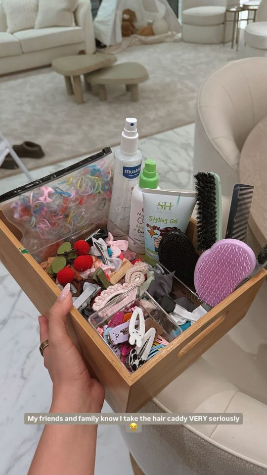 Bamboo tray filled with hair accessories and styling products.