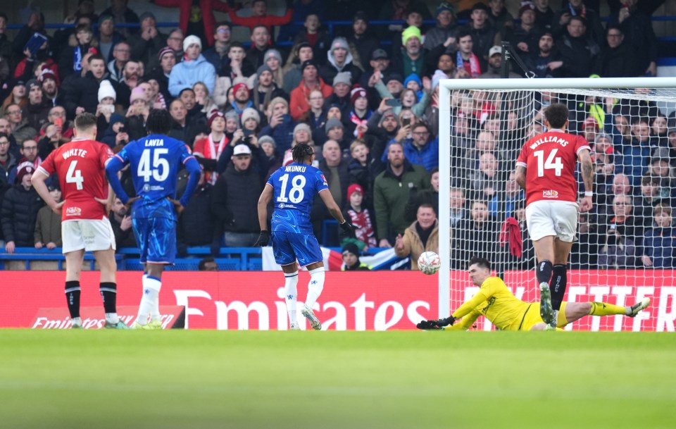 Morecambe's Harry Burgoyne saving a penalty kick from Chelsea's Christopher Nkunku.