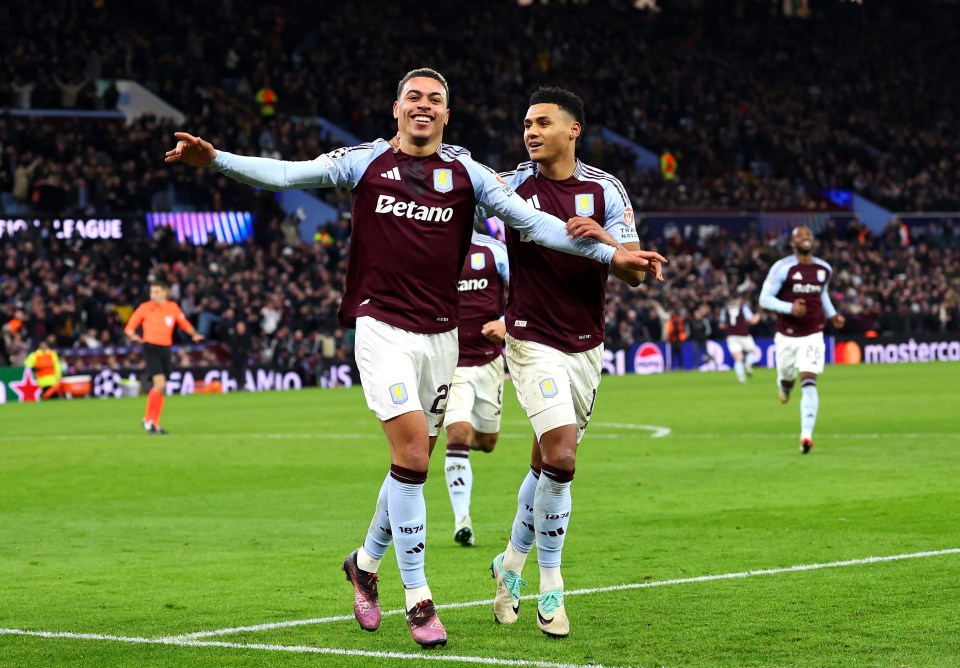 Aston Villa players celebrating a goal.