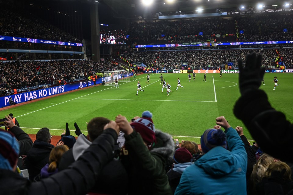 Aston Villa fans celebrating a goal at Villa Park.