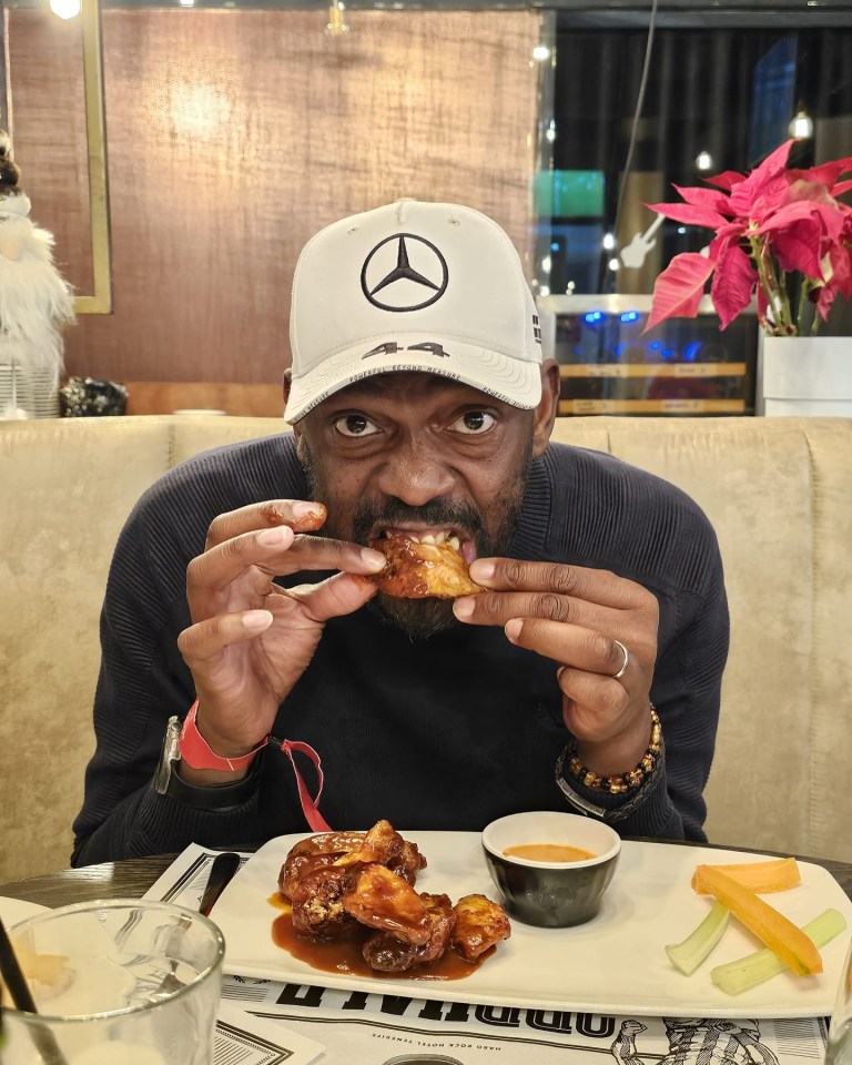 Man eating chicken wings.