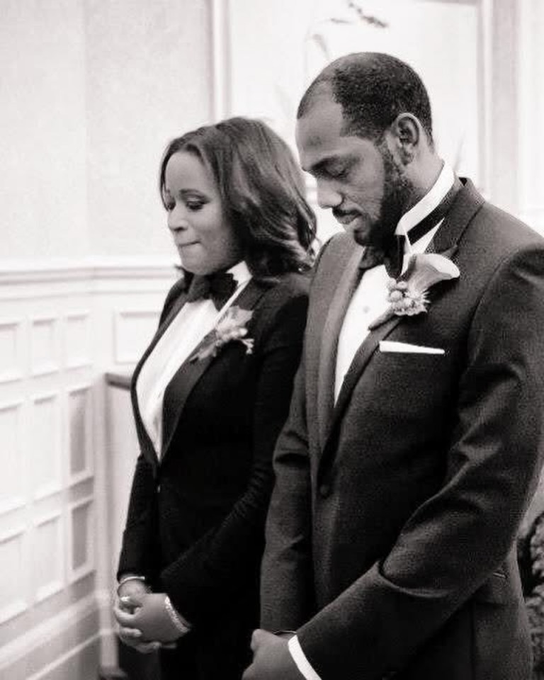 Black and white photo of a man and woman in formal wear.