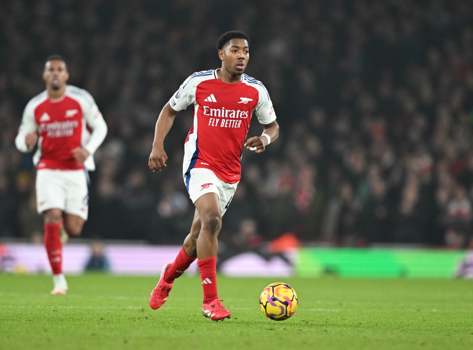 Myles Lewis-Skelly of Arsenal dribbling the ball during a Premier League match.