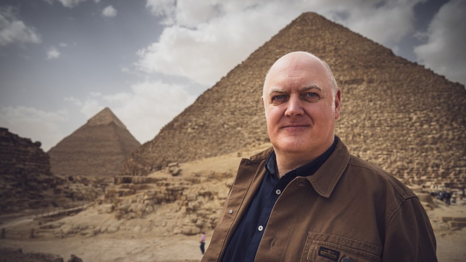 Dara O Briain in front of the pyramids.