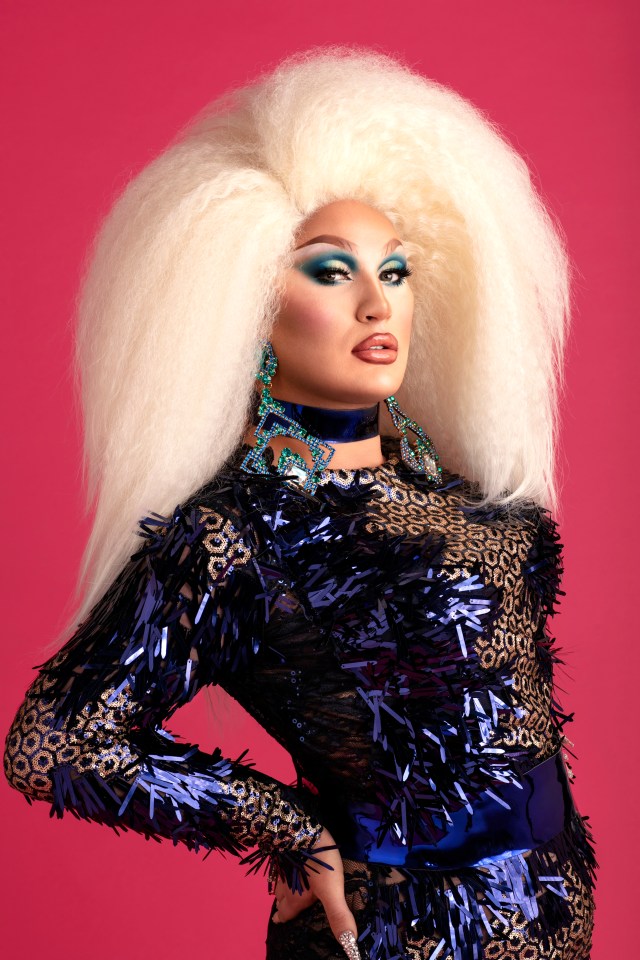 The Vivienne in a sparkly blue outfit and blonde wig for RuPaul's Drag Race UK.