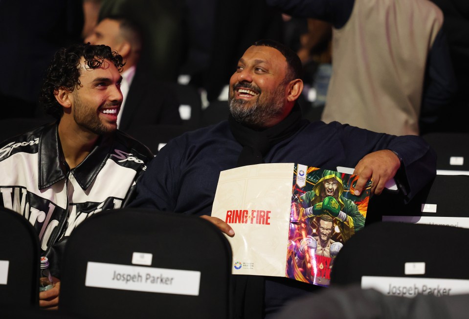 Naseem Hamed and his son at a boxing match.