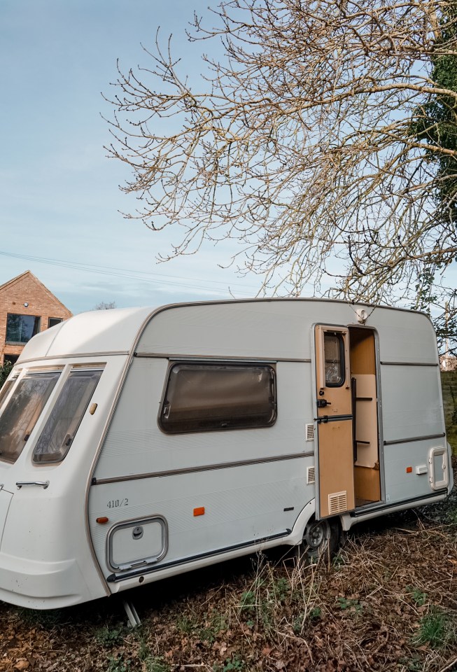 Refurbished caravan parked outdoors.