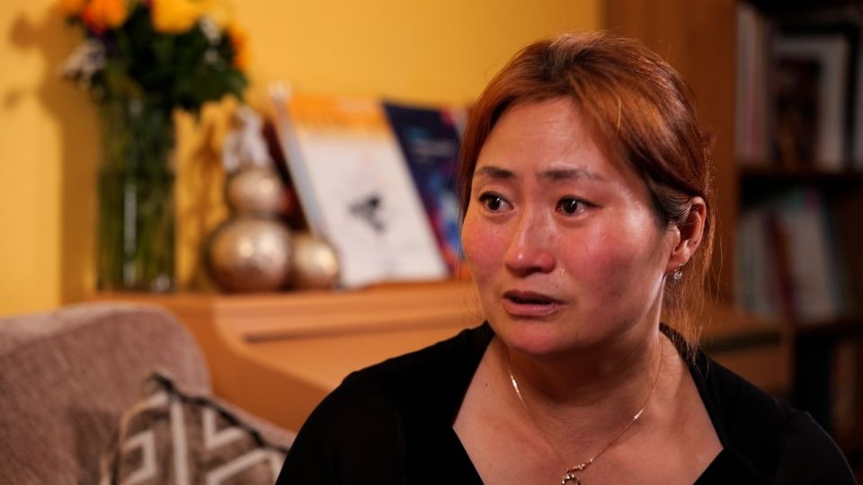 A North Korean defector, Kim Kyu-li, tearfully recounts her experiences.