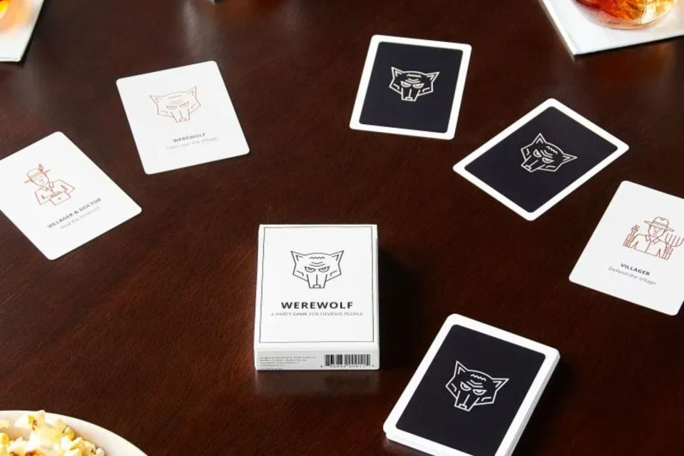 Werewolf card game pieces on a table.