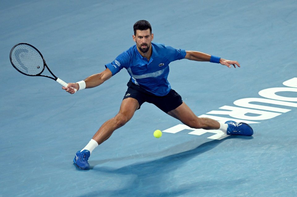 Novak Djokovic playing tennis.