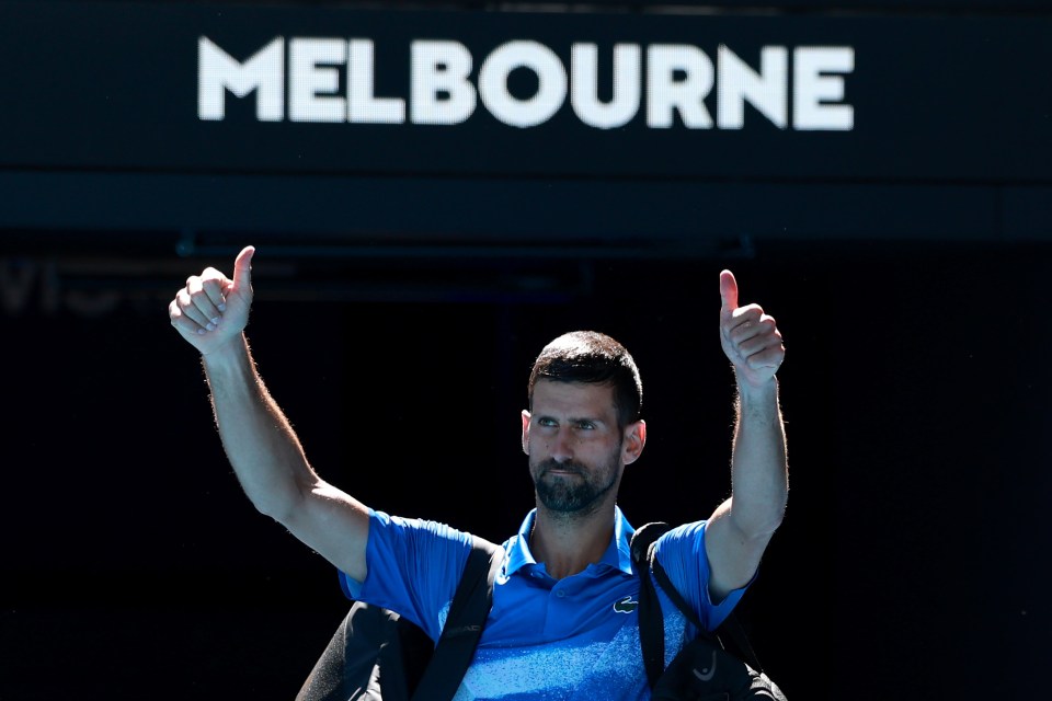 Novak Djokovic giving a thumbs up to the crowd after a tennis match in Melbourne.