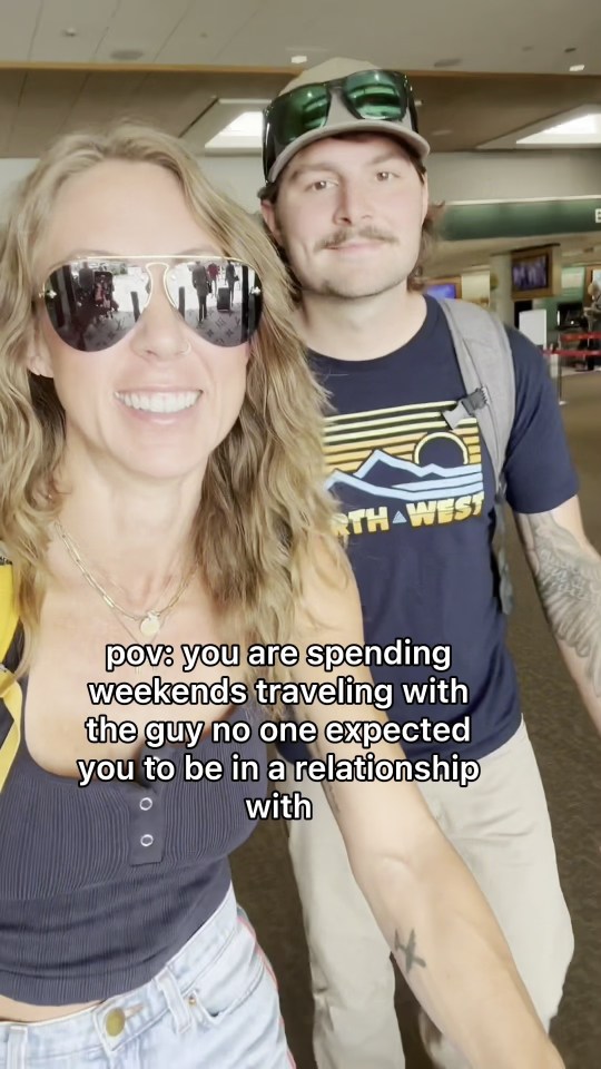 A woman and a man traveling together.