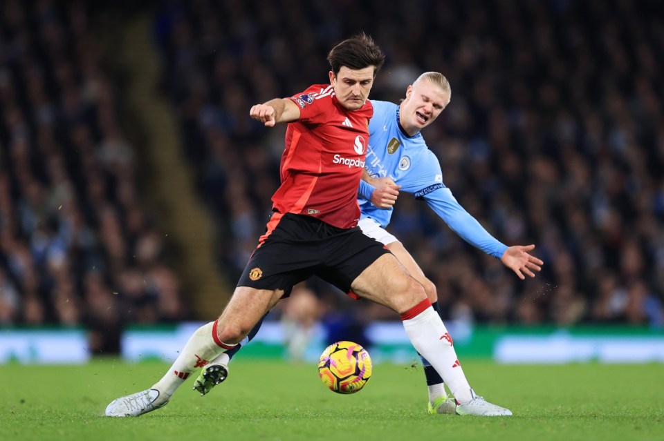 MANCHESTER, ENGLAND - DECEMBER 15: Harry Maguire of Manchester United battles with Erling Haaland of Manchester City during the Premier League match between Manchester City FC and Manchester United FC at Etihad Stadium on December 15, 2024 in Manchester, England. (Photo by Simon Stacpoole/Offside/Offside via Getty Images)