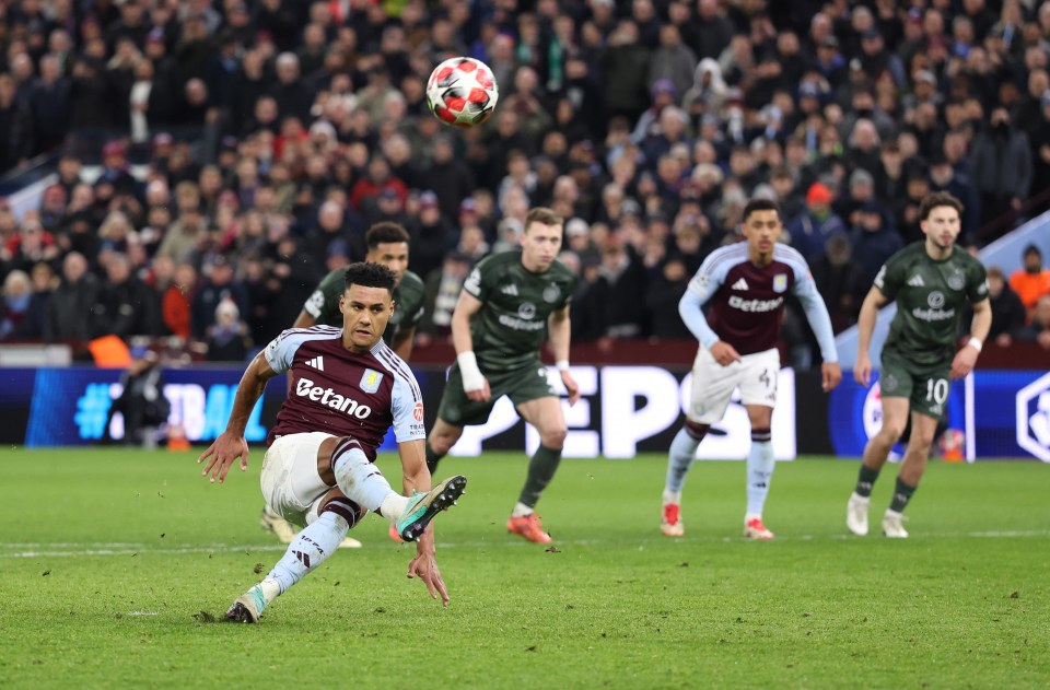 Ollie Watkins of Aston Villa slipping while taking a penalty kick.