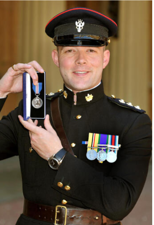 Officer displaying the Queen's Gallantry Medal.